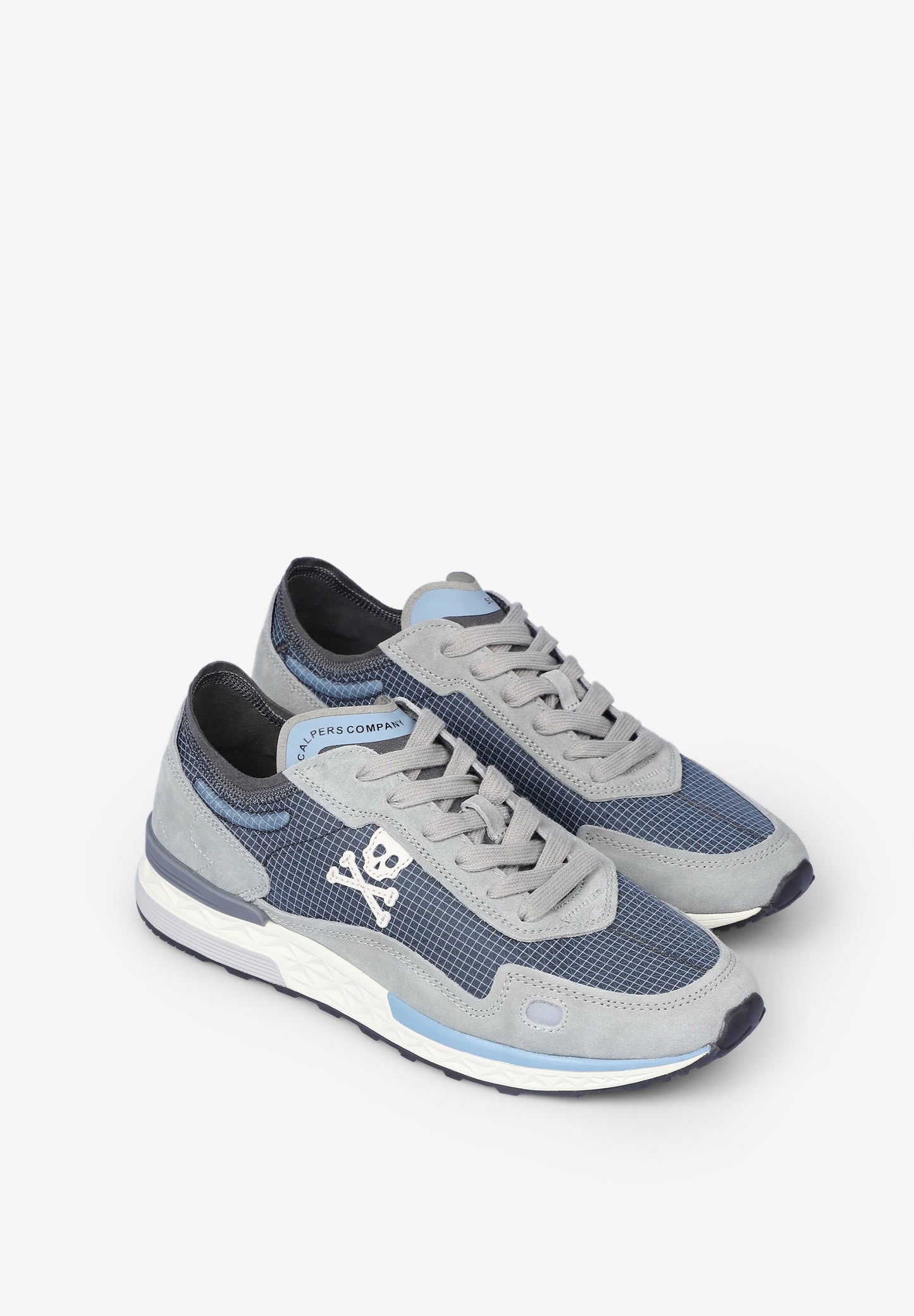 SNEAKERS CALAVERA DETALLES FLÚOR