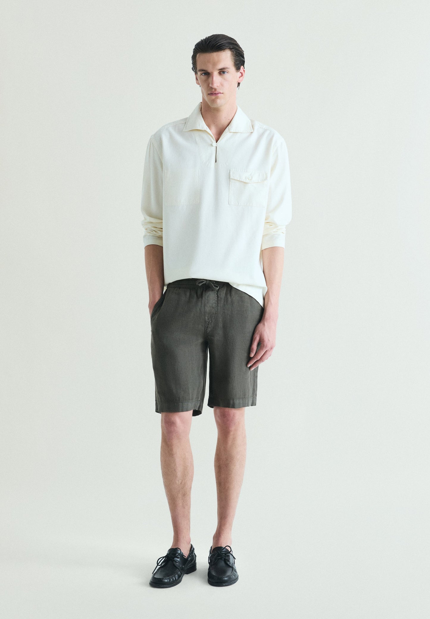 POLERA BOLSILLO CON BOTÓN