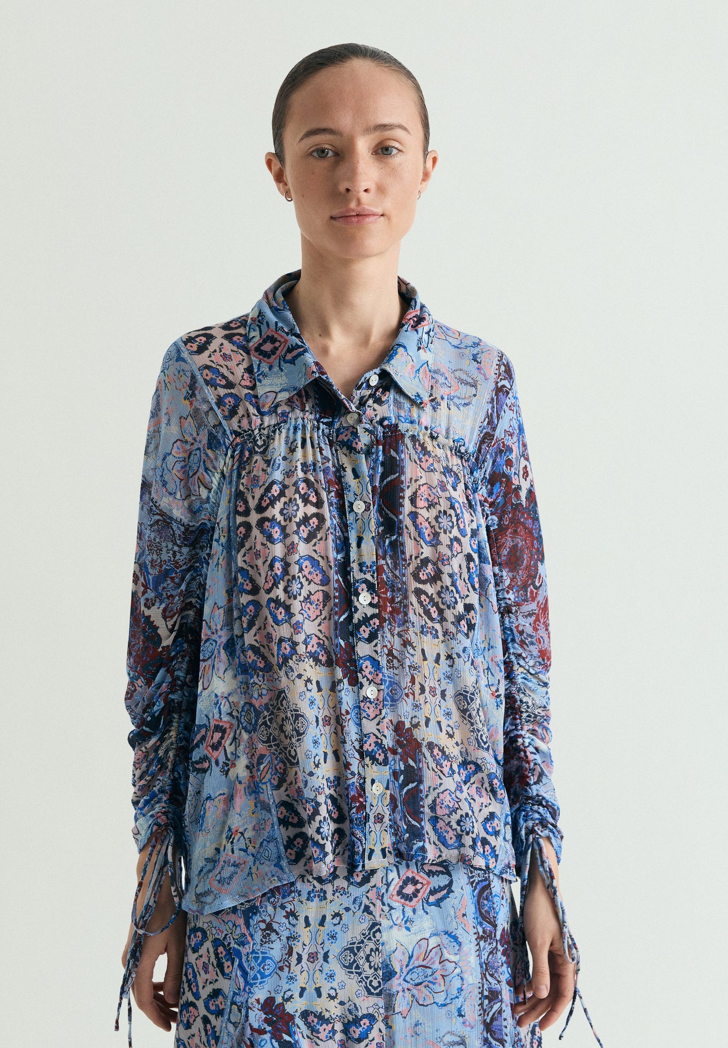 BLUSA FLUIDA ESTAMPADA