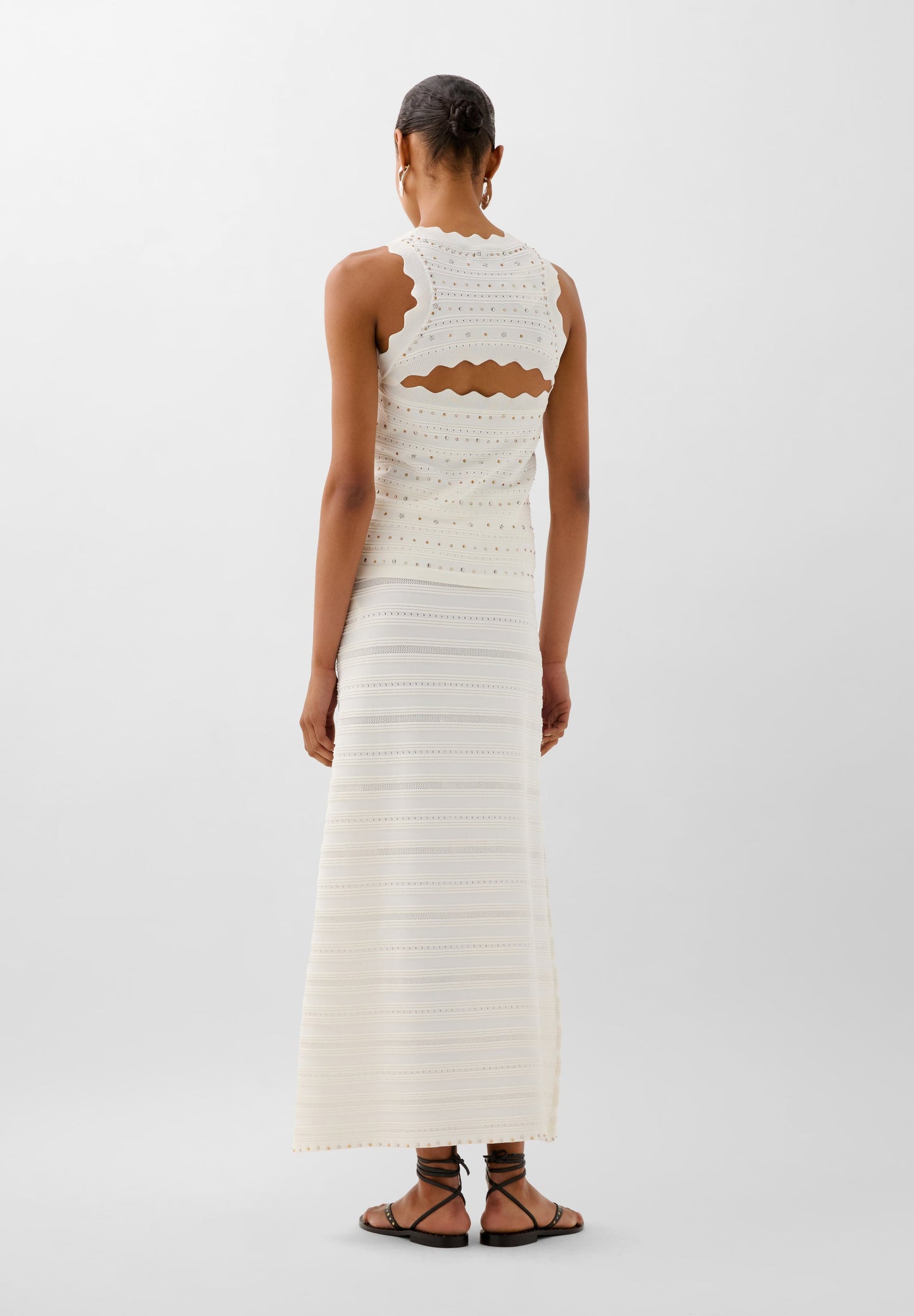 FALDA PUNTO TACHUELAS