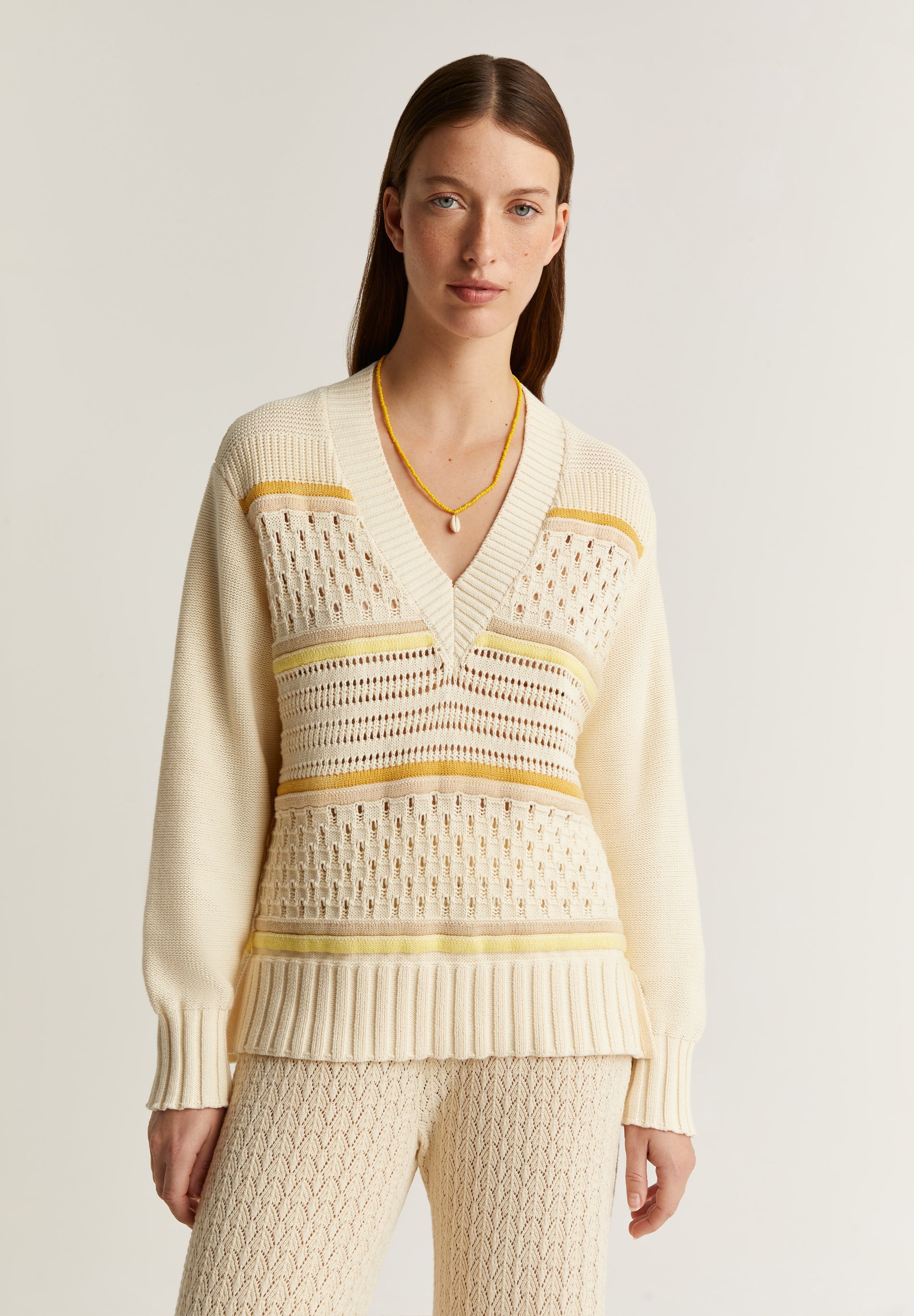 SWEATER PUNTO CALADOS ESCOTE EN V