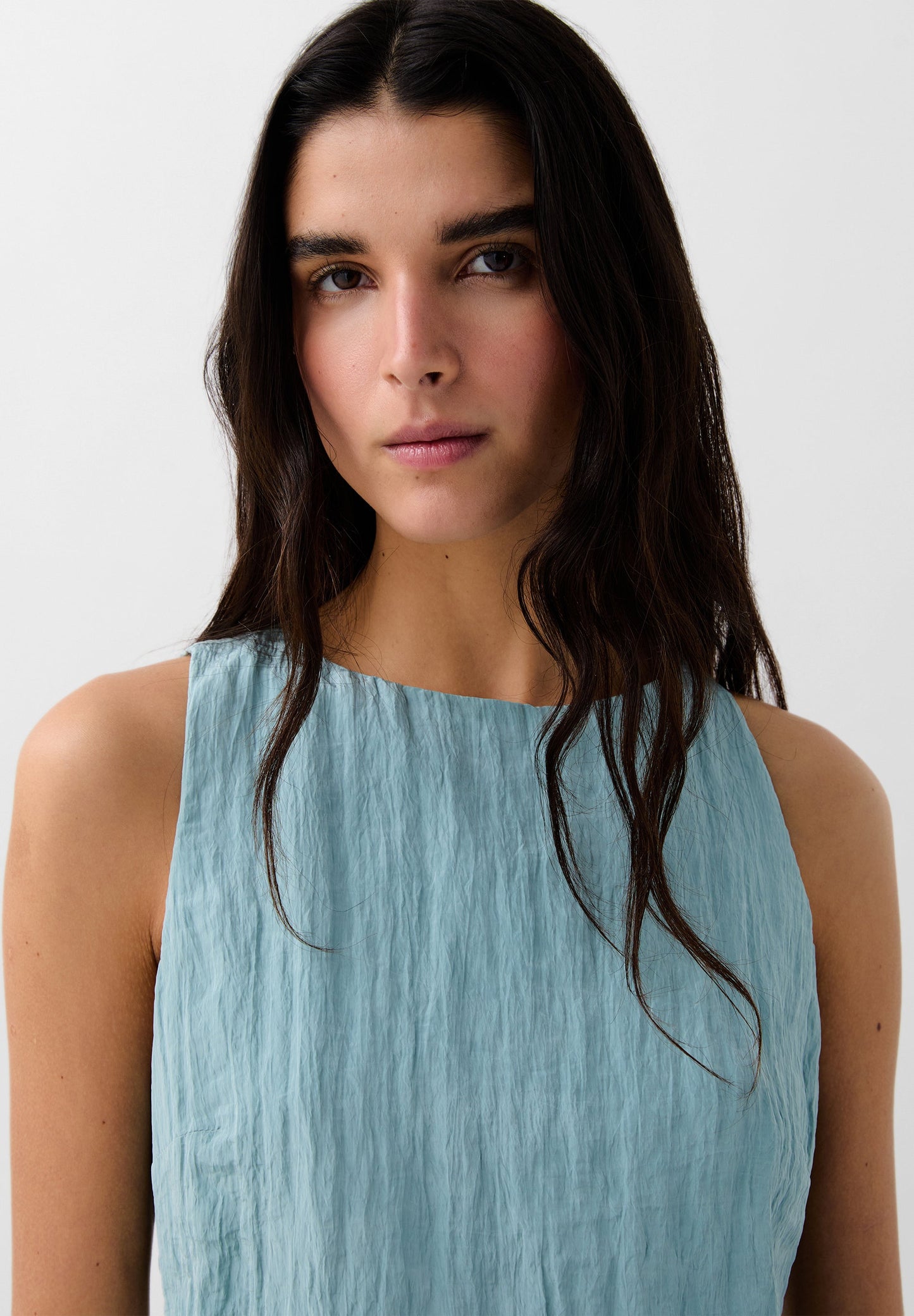 TOP PLISADO ASIMÉTRICO