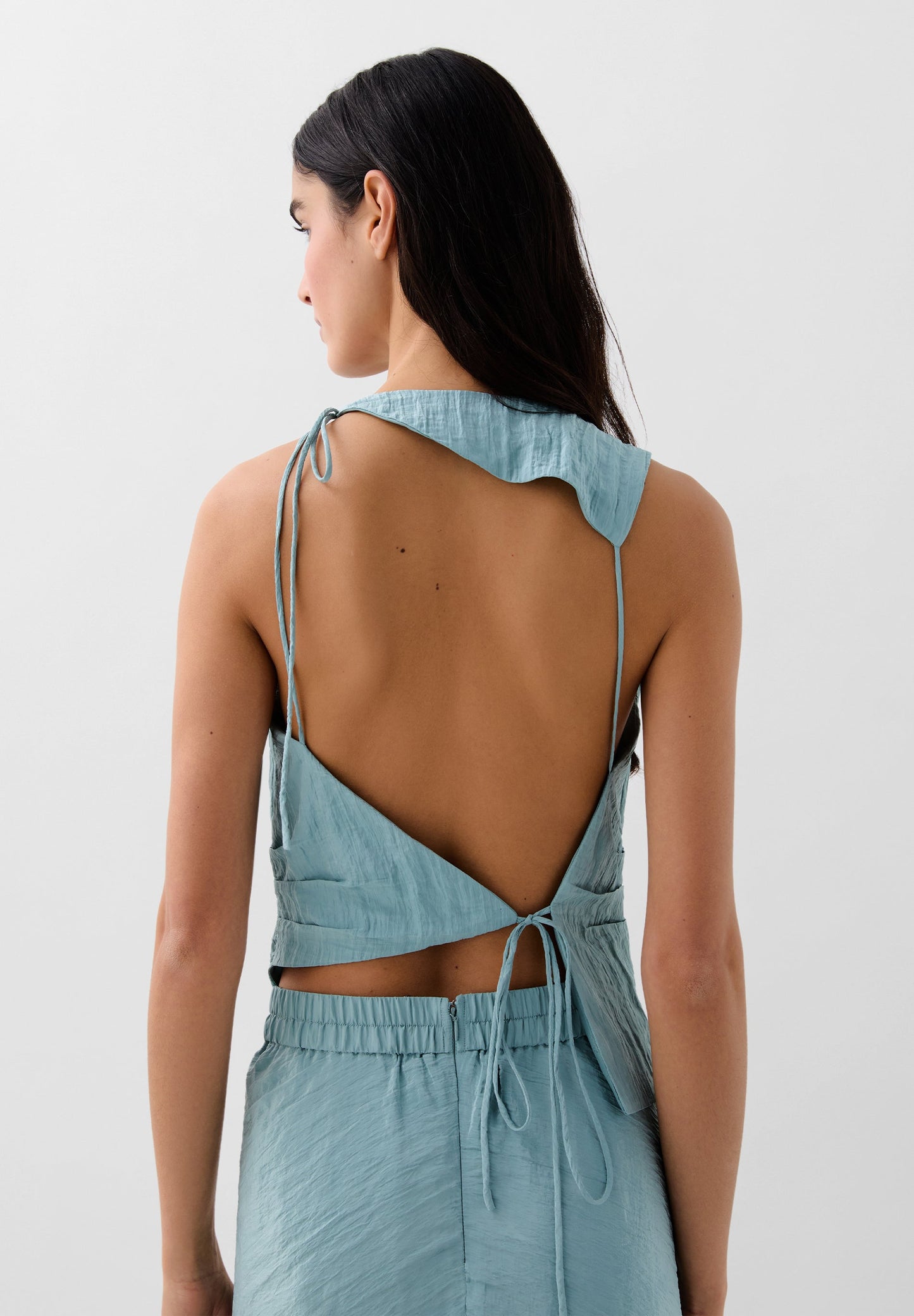 TOP PLISADO ASIMÉTRICO