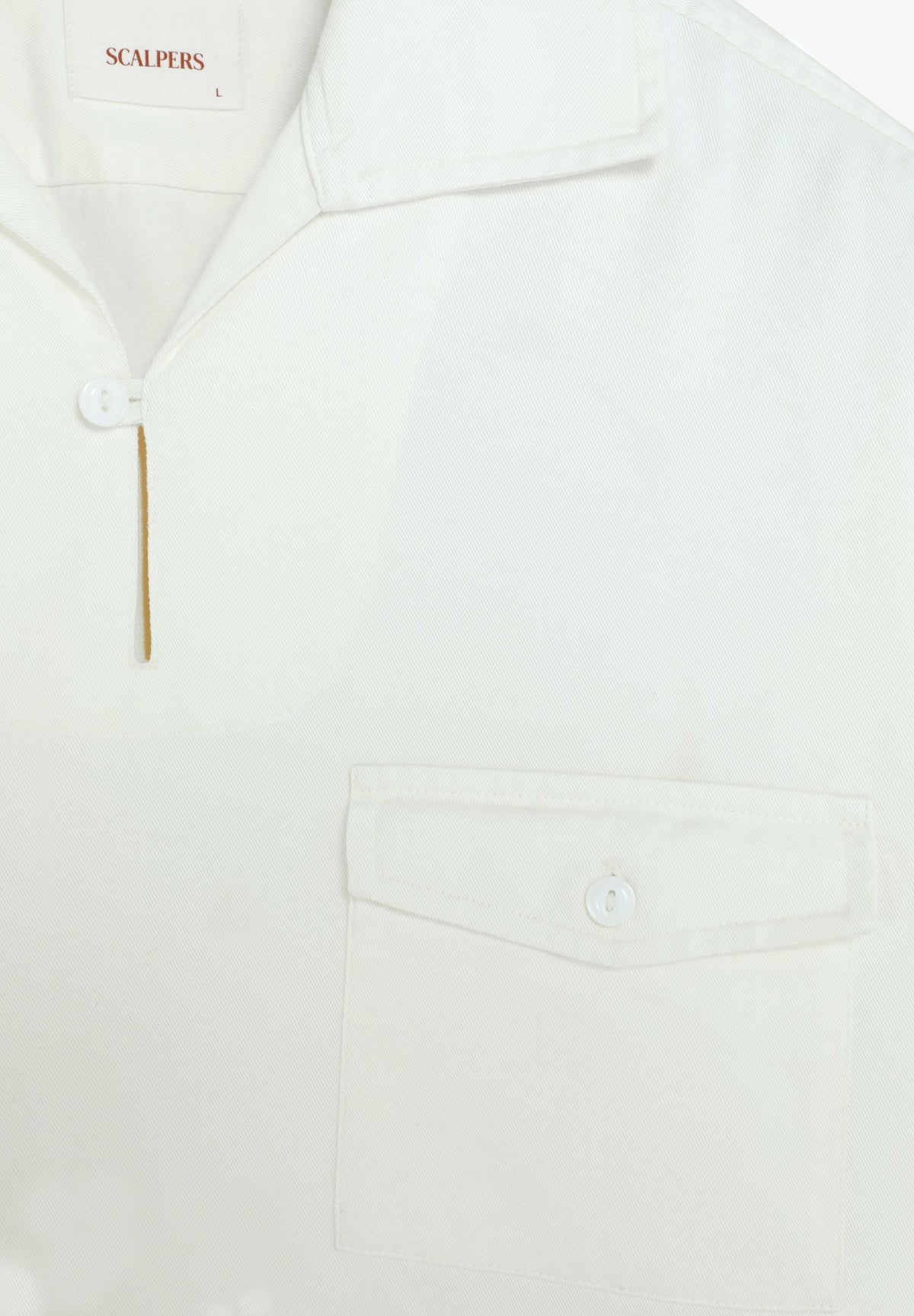 POLERA BOLSILLO CON BOTÓN