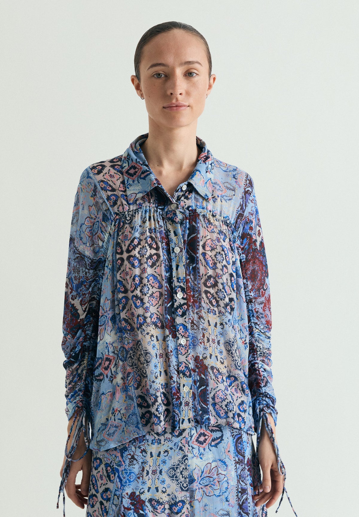 BLUSA FLUIDA ESTAMPADA